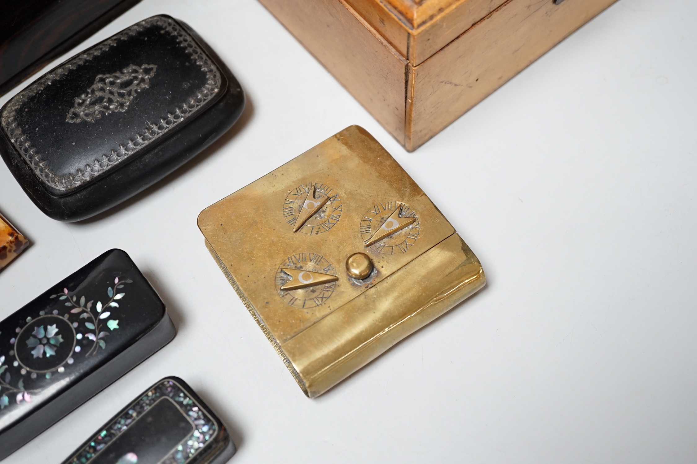 A Victorian Coromandel box containing a Victorian tortoiseshell mother-of-pearl inlaid card case, a Mauchline ware box and other boxes